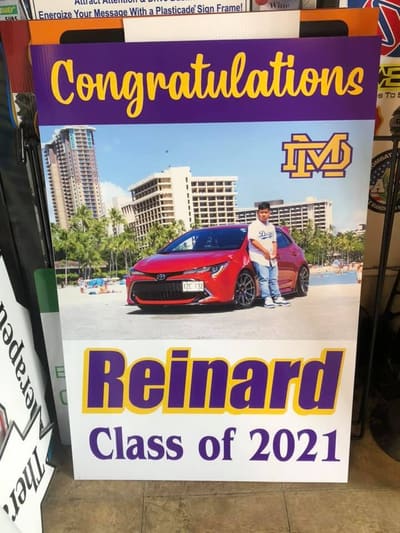 Congratulations graduation sign with school logo and full-color photo
