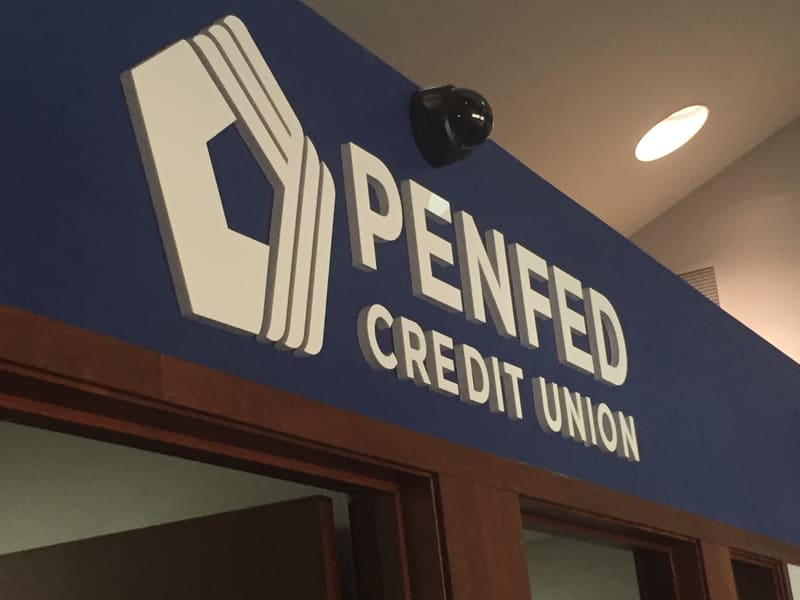 PenFed Credit Union dimensional interior sign above a doorway
