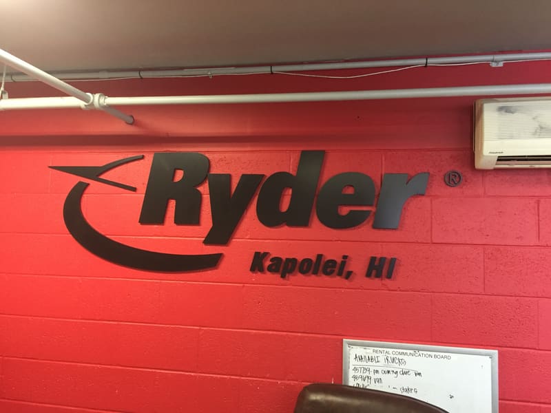 Dimensional Ryder logo sign with Kapolei, HI lettering on a red wall