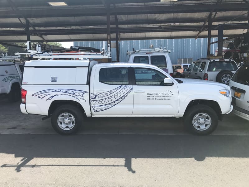 Hawaiian Telcom pickup truck with Polynesian-pattern side graphics