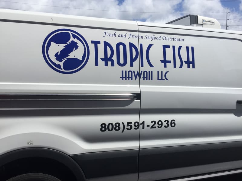 Tropic Fish Hawaii delivery van with a cut-vinyl logo and phone number